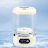 Small white mini washer with digital display on a light blue background