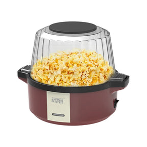Popcorn maker with popped popcorn inside on a white background