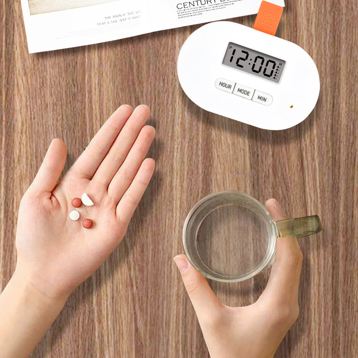 Person holding pills in one hand and a glass of water in the other, with a digital clock on a wooden surface. – Daily Medicine Organizer with Alarm- SASKA - saska.ae