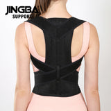Person wearing a black posture corrector with 'JINGBA SUPPORT' branding on a white background - Adjustable Posture Corrector - saska - saska.ae