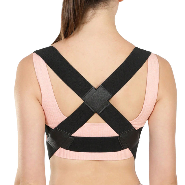 Person wearing a black posture corrector on a white background - Adjustable Posture Corrector for Back & Shoulder Support - SASKA - Saska.ae
