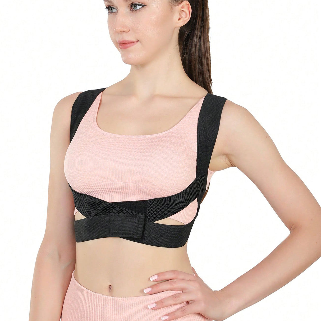 Woman wearing a black posture corrector on a white background - Adjustable Posture Corrector for Back & Shoulder Support - SASKA - Saska.ae