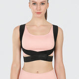 Woman wearing a black posture corrector on a white background - Adjustable Posture Corrector for Back & Shoulder Support - SASKA - Saska.ae